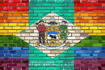 Brick Wall Delaware and Gay flags - Illustration,
Rainbow flag on brick textured background, 
Abstract grunge Delaware Flag and LGBT flag