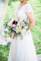 wedding bouquet in bride's hands