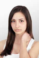 Woman In Pain. Closeup Of Beautiful Young Female Feeling Painful Toothache, Touching Face With Hand. Sad Stressed Girl Feeling Strong Teeth, Jaw Or Neck Pain. Dental Health And Care. High Resolution