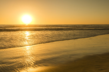 The bright sun of California. Sunset bright sun sets over the horizon. Beautiful beaches of California. South of the USA