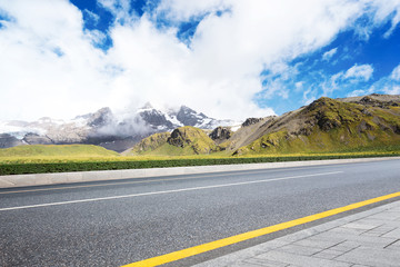 empty asphalt road with beautiful snow mountain