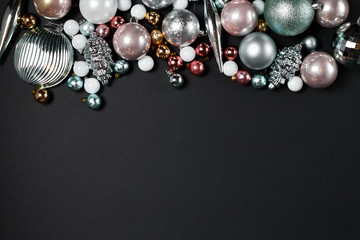 Christmas decoration and ornaments on black background.