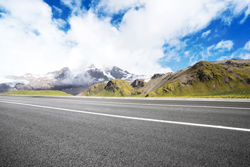 empty asphalt road with beautiful snow mountain