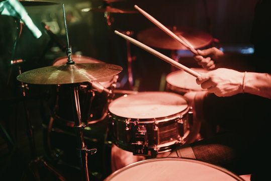 Drummer Playing His Drum Kit On Concert In Club