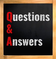 Q&A - questions and answers, chalk text on black board with wooden frame