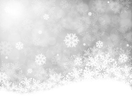 Christmas background with snowflakes on grey bokeh