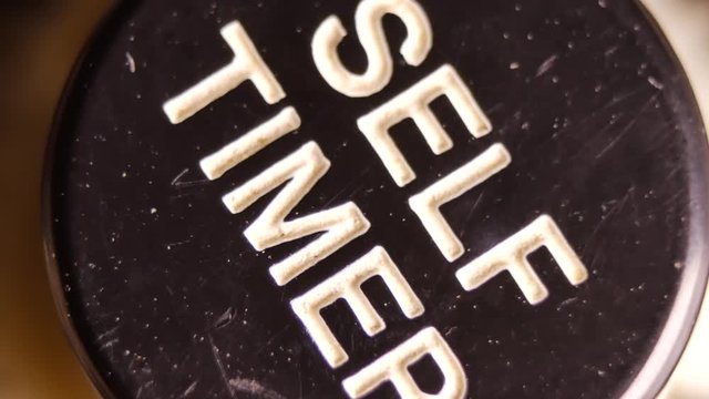 Cogwheel system of the self timer of a vintage camera - macro shot in 4K
