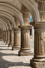 Fototapeta premium Antigua, Guatemala: solid limestone Spanish arches in the main plaza of the popularr tourist destination town