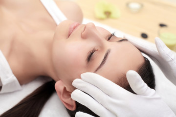 Face Massage. Close-up of a Young Woman Getting Spa Treatment.