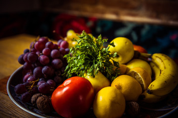 Juicy fruits and vegetables on a wooden table