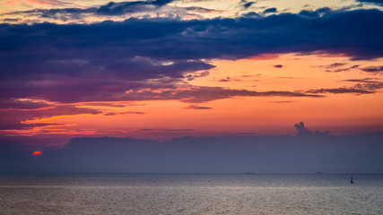 Fototapeta na wymiar Breathtaking sunset over calm sea in summer