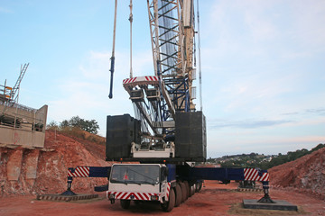 Crane laying concrete bridge beams