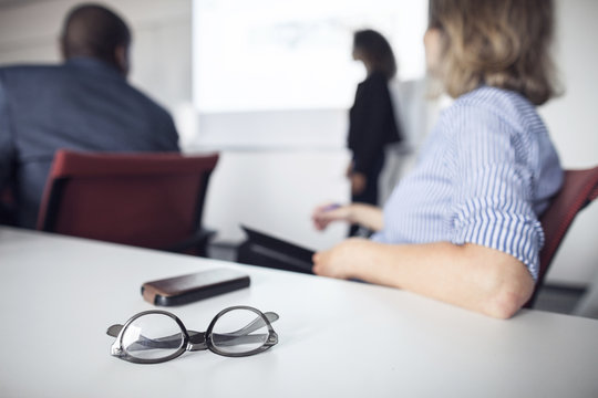 Architect giving presentation at business meeting