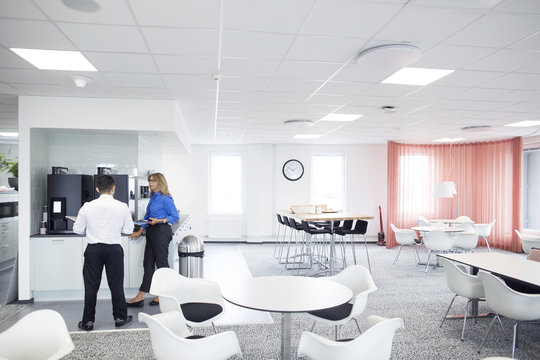 Architects talking in dining hall