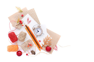 Autumn background with pencils, envelopes and an alarm clock. Top view. Space for your text.