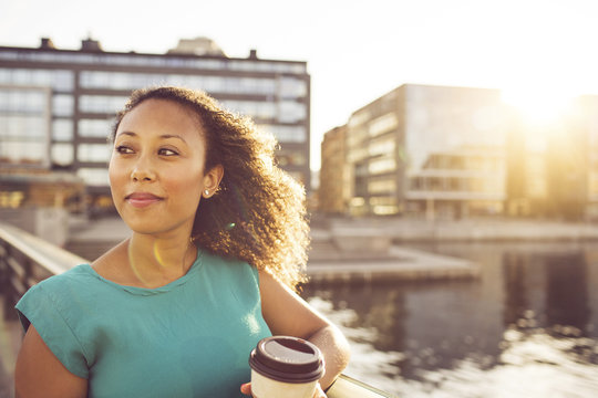 Businesswoman with disposable cup