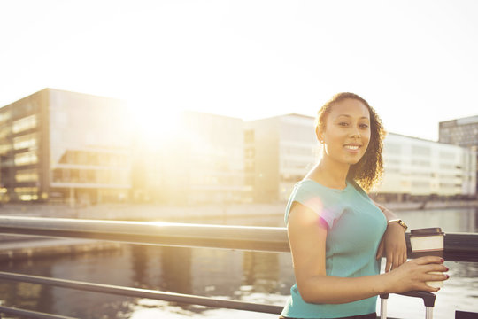 Businesswoman with disposable cup