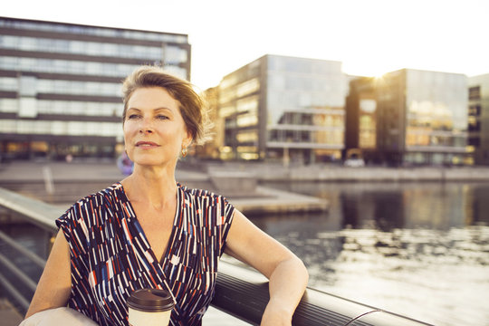 Businesswoman with disposable cup