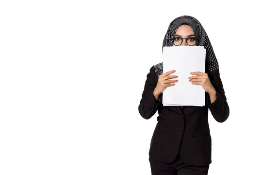 Beautiful modern Asian Muslim business woman holding reports and looking at camera,isolated on white background with clipping path.