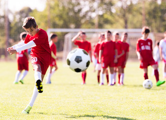 Kids soccer football - young children players match on soccer field