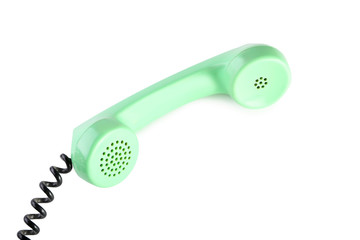 Green telephone handset isolated on a white