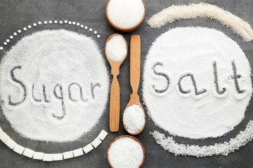 Inscription Sugar and Salt on grey wooden table