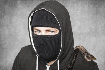 thief with a crowbar in his hand, close up