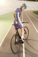 Naklejka premium cyclist on cycle race track