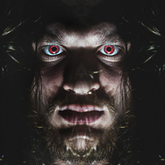 Portrait of a man with a red eye for horror or halloween.