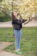 Glamorous young caucasian woman in black leather jacket