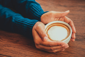 hand hold coffee cup