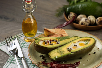 Obraz na płótnie Canvas Eggs baked in avocado