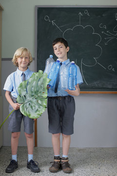 School boys giving science presentation