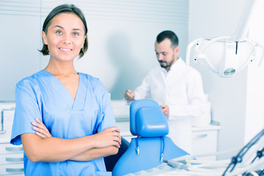 Portrait of dentist and assistant