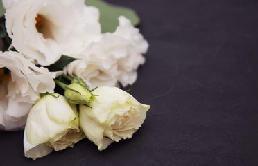 White Eustoma Flowers on black background