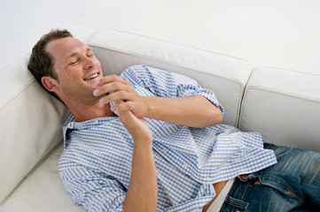 A man lying on sofa