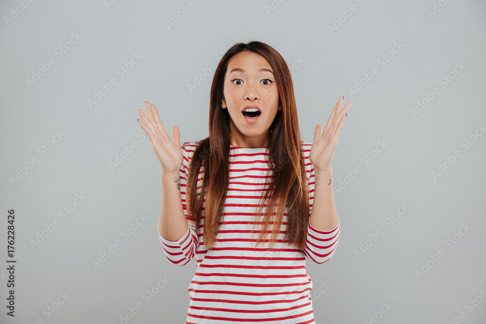 Poster Portrait of a happy excited woman standing with open mouth