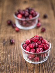 Some fresh Dried Cranberries (selective focus; close-up shot)