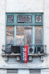 Old windows setting with red and black flag 