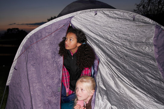 Girls in tent at dusk