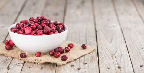 Some fresh Dried Cranberries (selective focus; close-up shot)