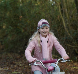Girl riding bike in countryside