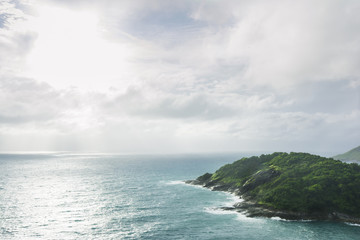Fototapeta na wymiar island in the ocean with clouds