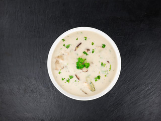 Porcini Soup on a slate slab, selective focus