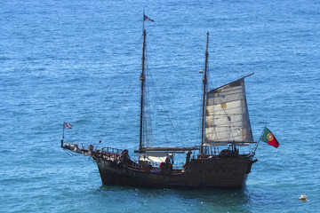 A view of a boat on Praia da Rocha in Portimao, Algarve region, Portugal