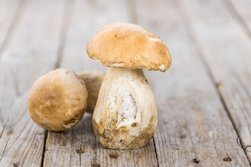 Fresh Porcinis (raw) on a vintage background (close-up shot)