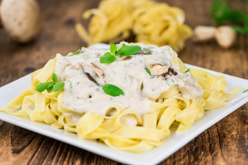 Fresh made Porcini pasta on a rustic background