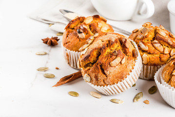 Autumn and winter baked pastries. Healthy pumpkin muffins with traditional fall spices, pumpkin...