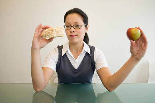 A Business Woman Deciding What To Eat