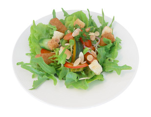 vegetable salad on white dish isolated